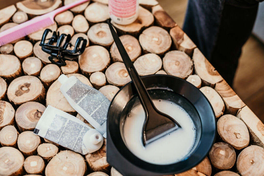 Lea Salon Studios Mixing hair dye ingredient in bowl